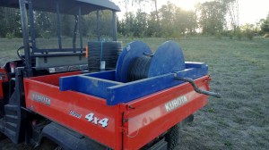 The drip tape winder and a few rolls of drip tape.